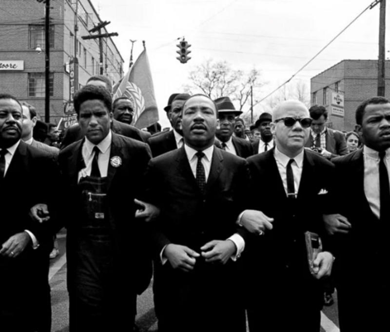 1. Martin Luther King Jr. Leading a March in Selma, 2. President Lyndon B. Johnson signing the Voting Rights Act, 3. Dune release, 4. In Cold Blood, 5. Marchers Crossing the Edmund Pettus Bridge, 6. First commercial communications satellite, 7. Students Protesting the Vietnam War, 8. Malcolm X in One of His Last Speeches, 9. The Gemini 4 Spacewalk, 10. The Sound of Music premiere, 11. Suburban Families in Mid-Century Homes, 12. NASA's spacecraft, 13. Prom was the night of nights, 14. Civil Rights Leaders in Washington, 15. Televisions in American Living Rooms, 16. The Watts Riots in Los Angeles, 17. Cars Cruising American Highways, 18. Teenagers at the Beach, 19. Bars surrounded by music, 20. Fashion on the Streets of London, 21. NASA Engineers at Work, 22. Civil Rights Sit-Ins, 23. The Sound of Motown, 24. College Dorm Rooms, 25. Protestors Outside the White House, 26. Telephones and Switchboards, 27. Everyday Fashion in Small-Town America