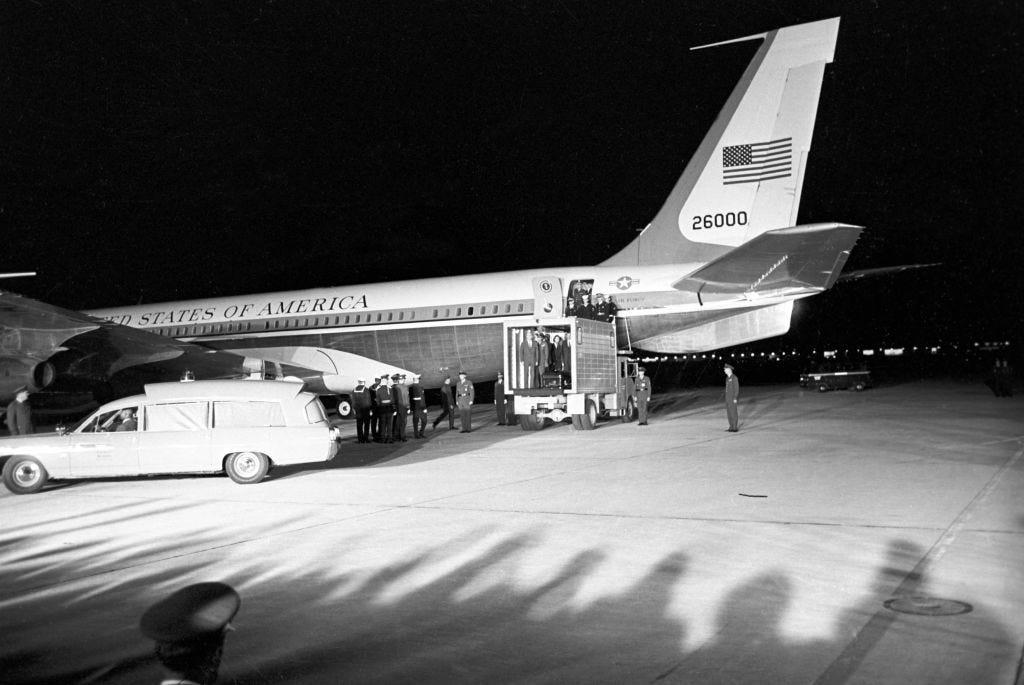 In a tragic period of American history, SAM 26000 transported President John F. Kennedy's body home after his assassination in 1963. Two phones were located behind the flight deck., An equipment storage space featured a first aid kit and firearms., Next, I walked by the plane's communication facility., Meals were prepared in the galley., The presidential stateroom was located down a long hallway., The president's spacious quarters featured a desk, couch, television, and private bathroom., The stateroom came with two phones, each with different purposes., Behind the presidential stateroom, a conference room provided more meeting space.