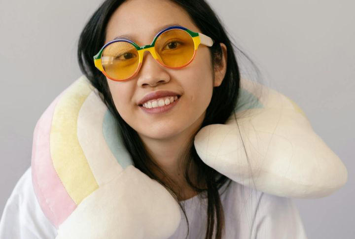 Neck Pillow That Supports Proper Posture Neck Pillow That Supports Proper Posture, Noise-Canceling Headphones, Compression Socks For Circulation, Portable Charger With Fast-Charge Capability, Lightweight Travel Blanket, Refillable Water Bottle With Filter, Travel Slippers With Rubber Soles, Travel Steamers That Take Up Half Your Bag, Heavy DSLR Cameras For Casual Trips, Multiple Pairs Of Shoes, Full-Sized Toiletry Kits, Hardcover Books Or Travel Guides, Bulky Travel Neck Fans, Money Belts