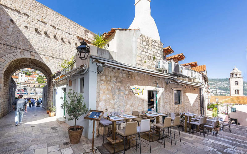 Find a restaurant by type:, Best all-rounders, Bota Sushi & Oyster Bar, Taj Mahal, Taverna Loggia, Urban & Veggie, Best for families, Konoba Dubrava, Konavoski Dvori, Pepper’s, Best for cheap eats, Buffet Škola, Best for walk-ins, Trattoria Carmen, Kiosk Dubrovnik, Best for fine dining, Gradska Kavana Arsenal Restaurant, Best for sea views, Panorama, Fratello’s, How we choose, About our expert, Jane Foster
