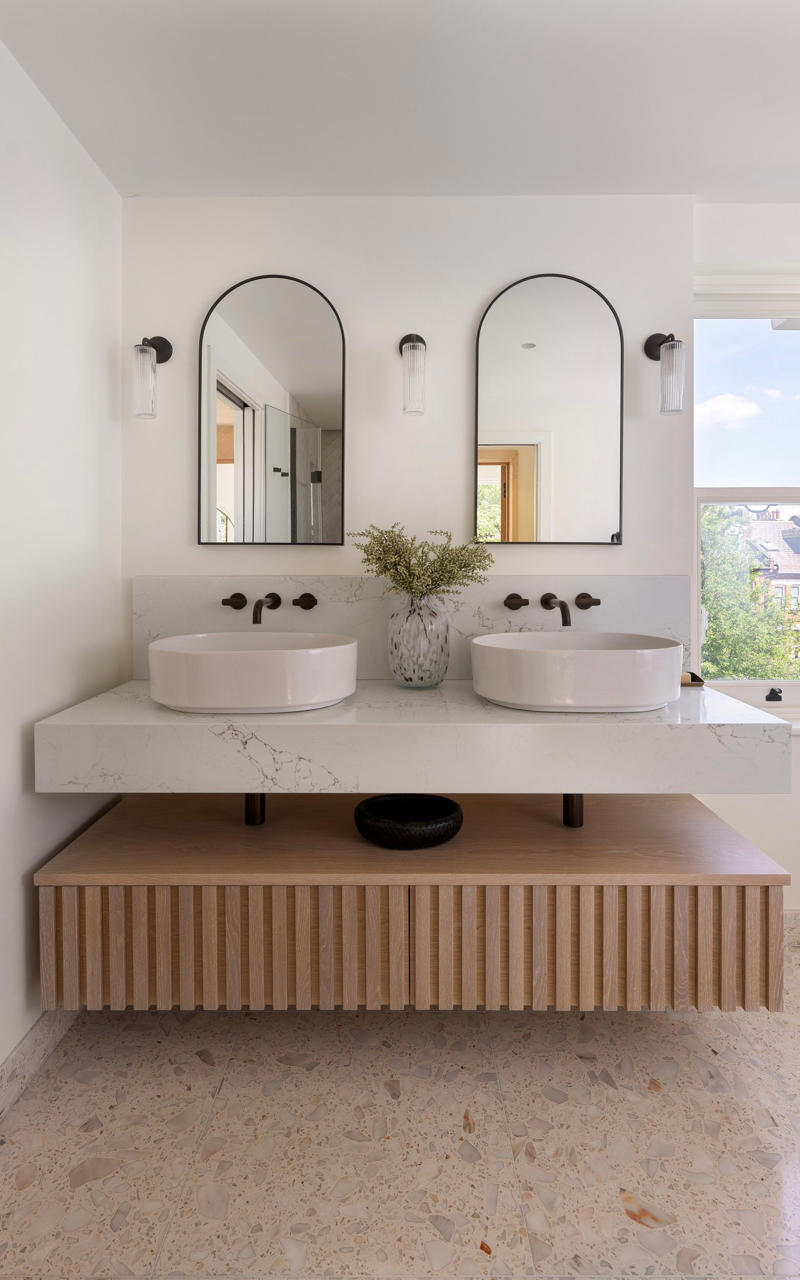 The en-suite, Start with the floor, Nail the layout, Keep it clean and crisp, Get clever with storage, Add interest to a monochrome palette, Light it like a living room, Work with flaws, Kate’s tips for creating a modern bathroom with a timeless touch, Ground your space in natural, earthy hues, Layer in texture for depth and interest, Keep fixtures simple and enduring, Balance organic warmth with clean lines, Anchor your palette, then layer thoughtfully