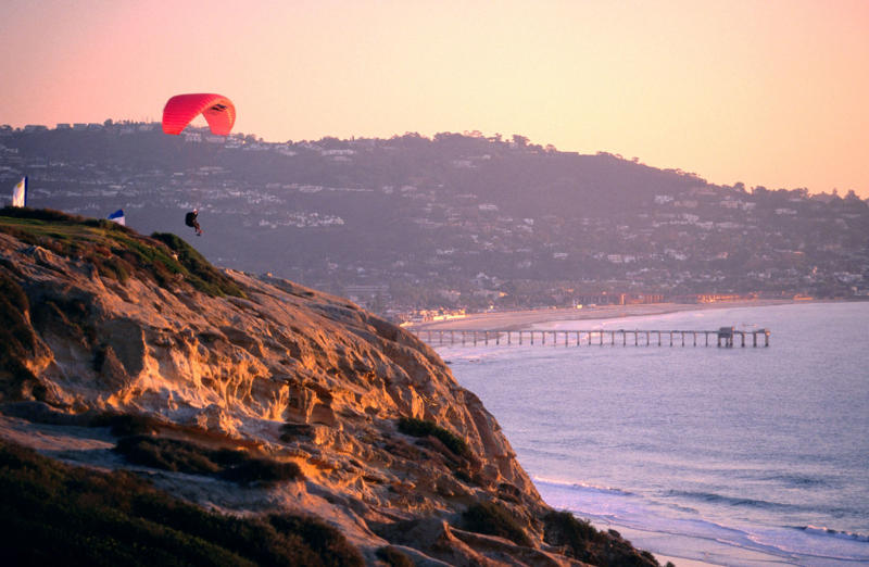 Torrey Pines State Natural Reserve, Museum of Contemporary Art San Diego, San Diego Zoo, Torrey Pines Golf Course, Belmont Park, Balboa Park, La Jolla Cove, Little Italy, Mission Basilica San Diego de Alcalá, Petco Park, Sunset Cliffs, Del Mar Racetrack, USS Midway Museum, Cabrillo National Monument, Barrio Logan, Coronado, Cedros Avenue Design District, North Park, Downtown Oceanside, Torrey Pines Gliderport, The Rady Shell at Jacobs Park