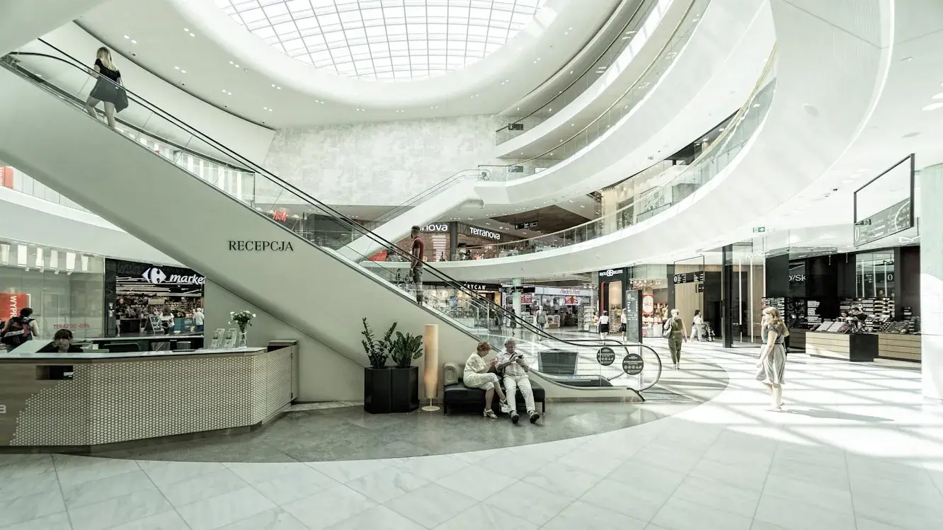 1. Try Out Perfume Samples, 2. Play with Gadgets in Electronics Stores, 3. Grab Food Court Samples, 4. Watch People Ice Skate, 5. Sit in Massage Chairs, 6. Play Arcade Games Without Paying, 7. Browse Bookstores, 8. Try on Clothes for Fun, 9. People-Watch from the Benches, 10. Ride the Escalators Just Because