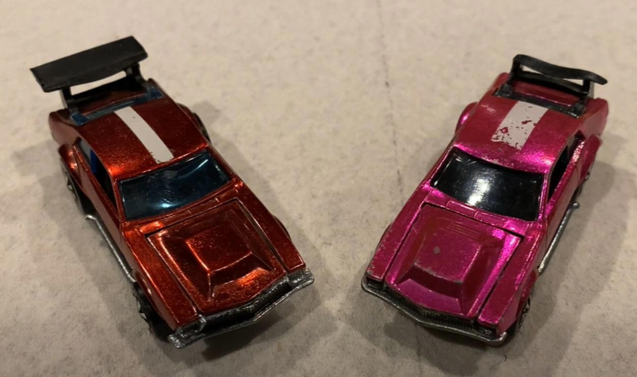 Money On Tiny Wheels, 1968 Brown Custom Camaro, 1968 White Custom Camaro, 1968 Pink Beatnik Bandit, 1969 Red Baron With White Interior, 1971 Red Olds 442 With Black Interior, 1972 Green Open Fire, 1972 Pink Superfine Turbine, 1974 Blue Rodger Dodger, 1974 Magenta Rodger Dodger With White Interior, 1977 White Z-Whiz, 1968 Python With “Cheetah” Base, 1968 Custom Volkswagen Without Sunroof, 1968 Rear-Loading Volkswagen Beach Bomb, 1970 Ed Shaver Custom AMX, 1969 Purple Olds 442, 1971 Purple Olds 442, 1970 Mad Maverick With “Mad” Base, 1971 Snake And Mongoose Dragsters, 1969 Purple Bye Focal, 1970 Purple Olds 442 With White Interior, 1968 Custom Barracuda In Apple Green
