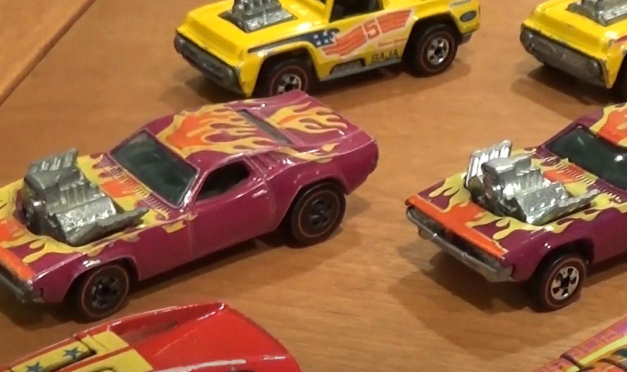Money On Tiny Wheels, 1968 Brown Custom Camaro, 1968 White Custom Camaro, 1968 Pink Beatnik Bandit, 1969 Red Baron With White Interior, 1971 Red Olds 442 With Black Interior, 1972 Green Open Fire, 1972 Pink Superfine Turbine, 1974 Blue Rodger Dodger, 1974 Magenta Rodger Dodger With White Interior, 1977 White Z-Whiz, 1968 Python With “Cheetah” Base, 1968 Custom Volkswagen Without Sunroof, 1968 Rear-Loading Volkswagen Beach Bomb, 1970 Ed Shaver Custom AMX, 1969 Purple Olds 442, 1971 Purple Olds 442, 1970 Mad Maverick With “Mad” Base, 1971 Snake And Mongoose Dragsters, 1969 Purple Bye Focal, 1970 Purple Olds 442 With White Interior, 1968 Custom Barracuda In Apple Green