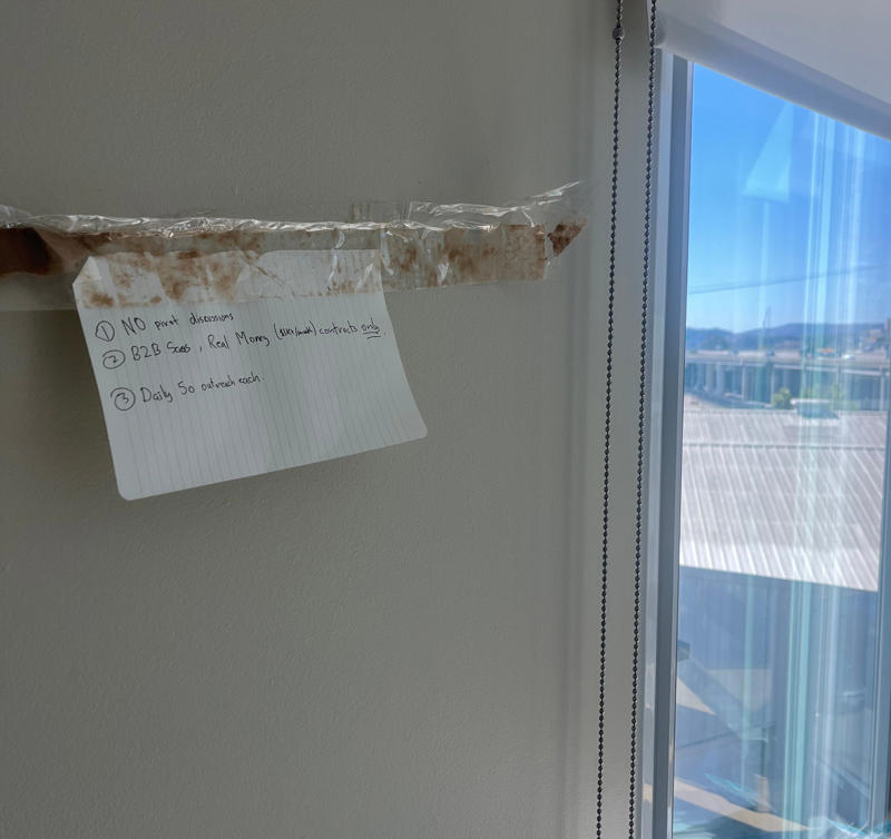 Skurikhin stuck the cofounders' three tenets above their desks with packing tape. Docket cofounder Boris Skurikhin uses a cardboard box as a nightstand., Skurikhin stuck the cofounders' three tenets above their desks with packing tape., TrainLoop cofounder Jackson Stokes finally has a dishwasher., Gale cofounder Haokun Qin stores protein shakes under his bed., Qin's skincare products are from his mom and Amazon.
