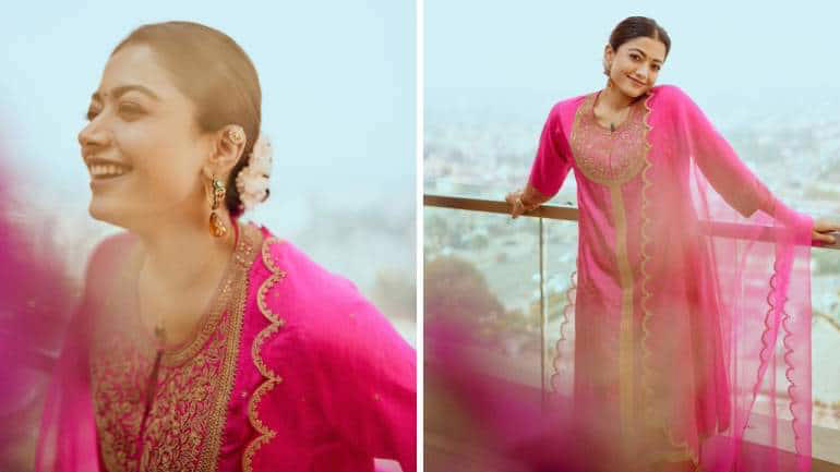 Vibrant in Fuchsia Pink A hot pink hue makes festive wear stand out. Crafted in fine silk, Rashmika’s kurta set features floral motifs and lace-like embroidery on the centre front and sleeve. Her organza dupatta is equally beautiful.