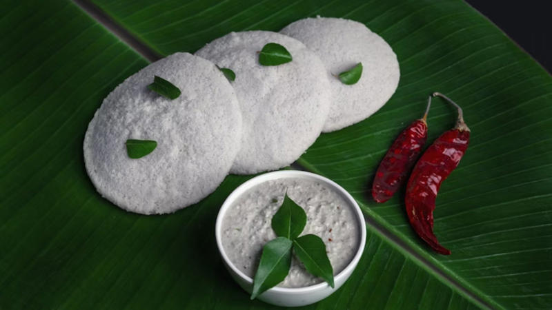 Idli: These steamed rice cakes are low in calories, easy on the stomach, and can be paired with sambar for extra protein.