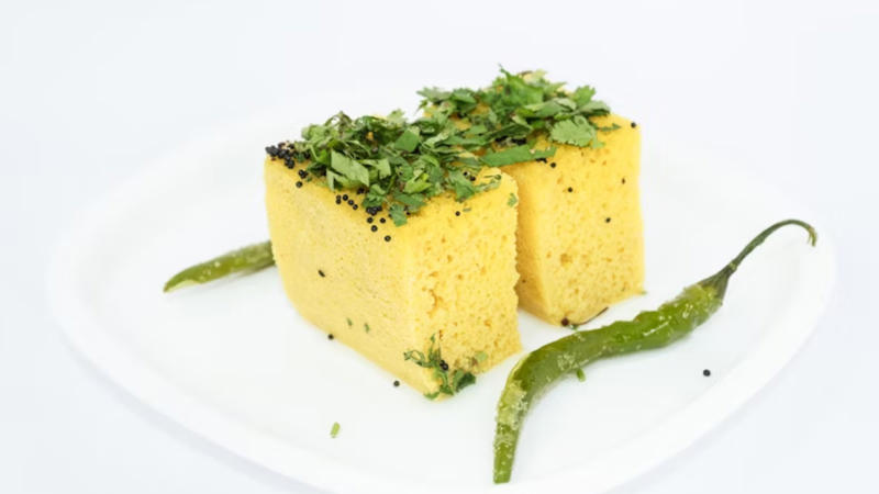 Dhokla: This steamed Gujarati snack is light, probiotic-rich, and easy to digest, making it a gut-friendly choice.
