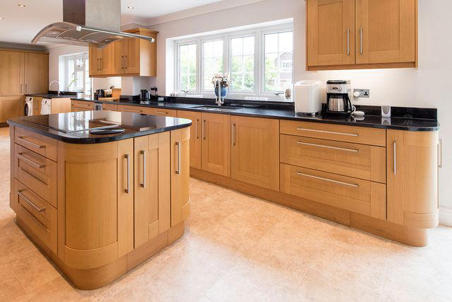 Honey Oak Wood, Raised Panel Doors, Flashy Gold Hardware, High Gloss Finishes, Open Shelving Everywhere