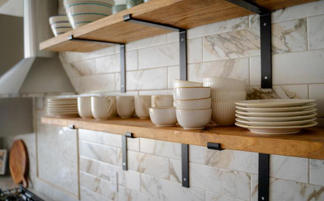 Honey Oak Wood, Raised Panel Doors, Flashy Gold Hardware, High Gloss Finishes, Open Shelving Everywhere