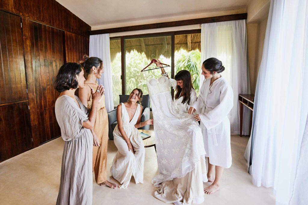 1. Not staying connected, 2. Not telling the DJ to stick to the wedding playlist, 3. Not planning/discussing how to cut the cake, 4. Buying expensive shoes, 5. Having bridesmaids stand behind the bride, 6. Scheduling more time to get ready, 7. Not scouting photo locations, 8. Regret spending so much money