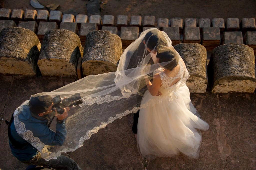 1. Not staying connected, 2. Not telling the DJ to stick to the wedding playlist, 3. Not planning/discussing how to cut the cake, 4. Buying expensive shoes, 5. Having bridesmaids stand behind the bride, 6. Scheduling more time to get ready, 7. Not scouting photo locations, 8. Regret spending so much money