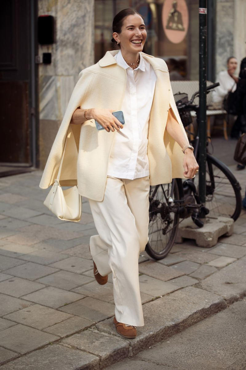 1. Wear a Slip Dress Over Satin Pants, 2. Mix Cotton Classics with Expert Tailoring, 3. Slip a Trench Coat Over a Blazer, 4. Layer Up on Knitwear Instead of a Scarf, 5. Style a Button-Up Under a Cape Jacket, 6. Add a Pop of Color With a Mock-Neck Top, 7. Use a Ribbed Turtleneck Under a Button-Down and Blazer, 8. Mix Necklines with a Sporty Finishing Touch