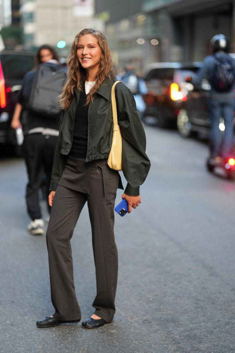 1. Wear a Slip Dress Over Satin Pants, 2. Mix Cotton Classics with Expert Tailoring, 3. Slip a Trench Coat Over a Blazer, 4. Layer Up on Knitwear Instead of a Scarf, 5. Style a Button-Up Under a Cape Jacket, 6. Add a Pop of Color With a Mock-Neck Top, 7. Use a Ribbed Turtleneck Under a Button-Down and Blazer, 8. Mix Necklines with a Sporty Finishing Touch