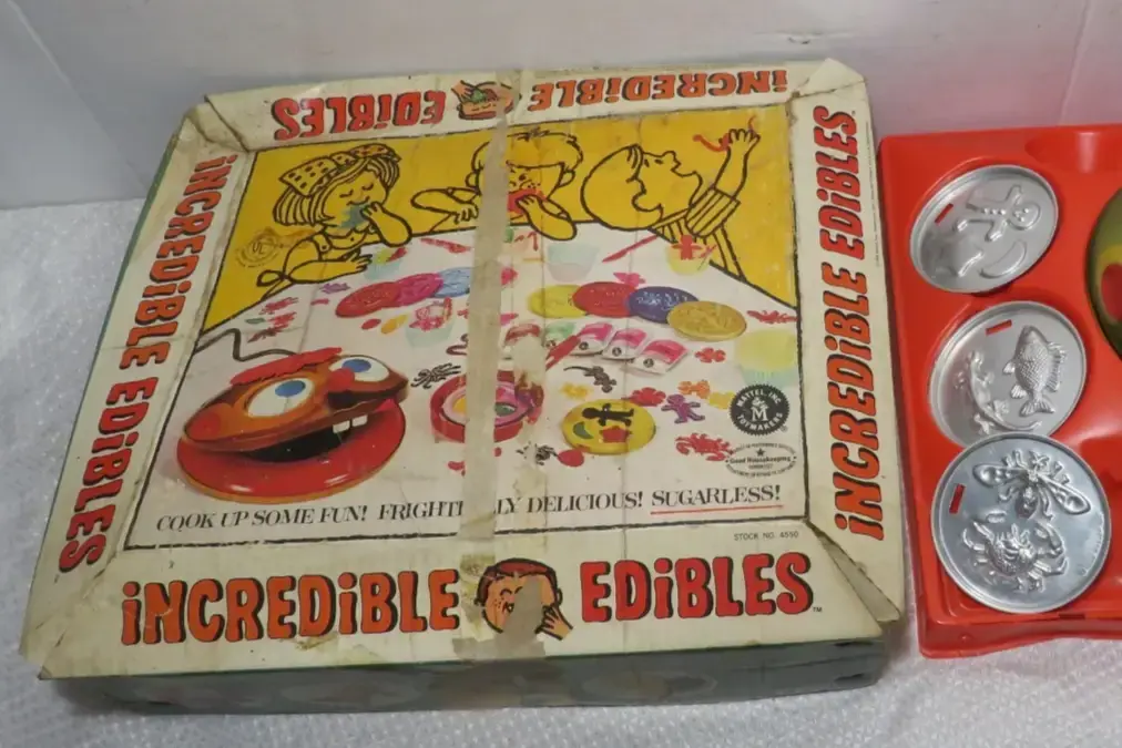 1. Clackers, 2. Lawn Darts, 3. Creepy Crawlers, 4. Rock ’Em Sock ’Em Robots, 5. Stretch Armstrong, 6. The Incredible Edibles, 7. Battling Tops, 8. Evel Knievel Stunt Cycle, 9. Weebles, 10. Big Wheel, 11. Shrinky Dinks, 12. Super Elastic Bubble Plastic