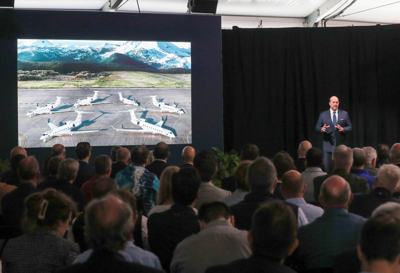 An image of the Gulfstream next-generation fleet is displayed as President Mark Burns speaks during the Exclusive Gulfstream Discover the Difference Customer event on Tuesday, September 30, 2025 at the Gulfstream Research and Development facility in Savannah, Ga..
