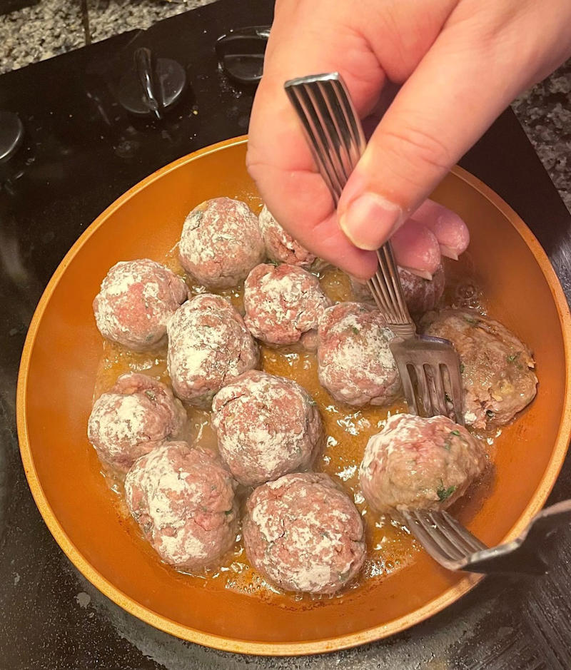 Before making the meatballs, we just need to do some quick prep., Then, mix everything together with your hands., Once your mixture is ready, start shaping the meatballs., Add the meatballs, one by one, into the pan., Use two forks to gently rotate each meatball every two minutes., It will take about 10 minutes to cook the meatballs.