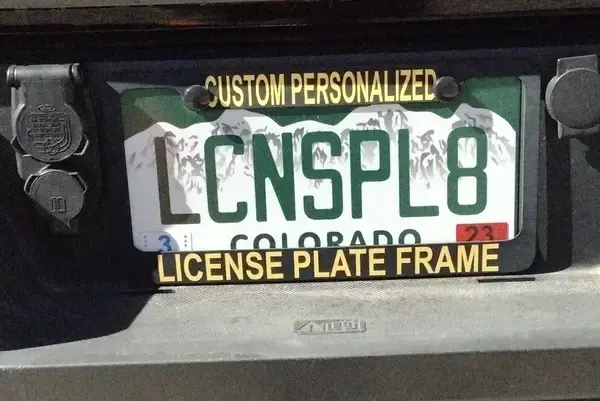 1. Whasaab, 2. Brand confusion, 3. Subauwu, 4. Get a load of this guy, 6. The impala, 7. An awh-sum car, 8. Ur obese, 9. Why be normal, 10. A very Canadian plate, 11. Comedy in one word, 12. Cheeto Jeep, 13. Luxury with a side of humility, 14. Midlife dream or crisis, 15. No problem parking, 16. Meta, 17. Sassy exit, 18. It’s a vibe, 19. License plate therapy session, 20. Purrsonality on wheels, 21. Owning it, 22. Keeping it literal, 23. Priorities on display, 24. Serving royal energy, 25. Weewoo on wheels, 26. Corvette over retirement, 27. Minivan mythology, 28. Big wheels, green dreams, 29. Owning the slow lane, 30. Queen of the mud pits