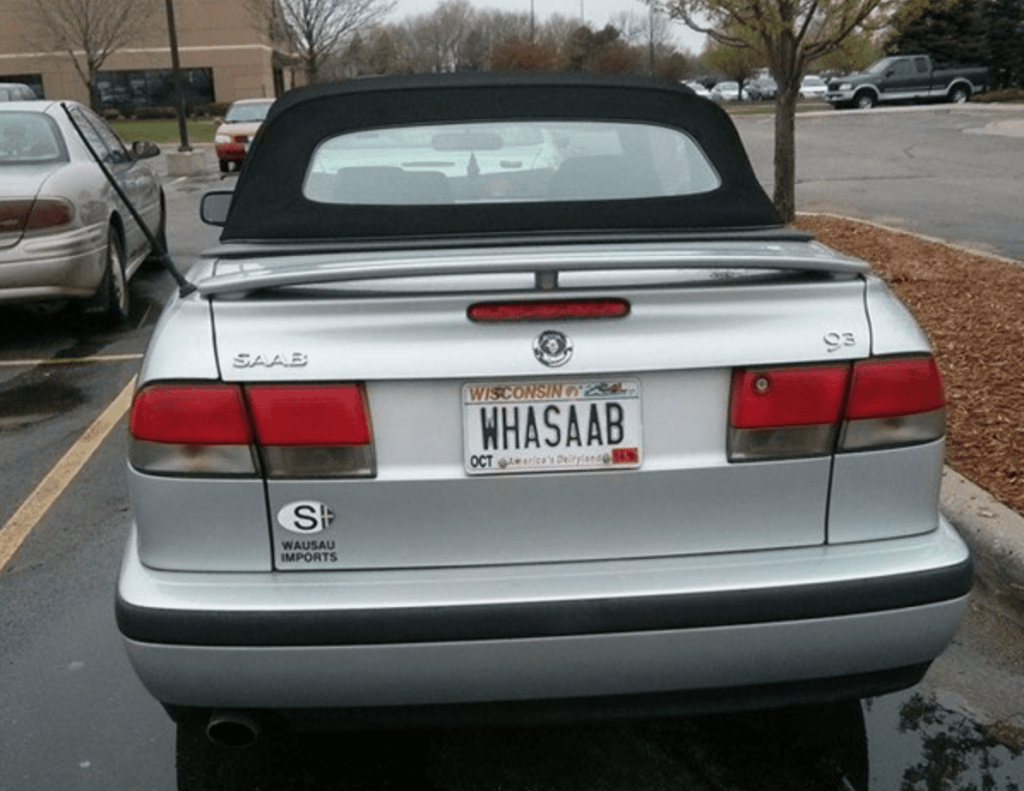 1. Whasaab, 2. Brand confusion, 3. Subauwu, 4. Get a load of this guy, 6. The impala, 7. An awh-sum car, 8. Ur obese, 9. Why be normal, 10. A very Canadian plate, 11. Comedy in one word, 12. Cheeto Jeep, 13. Luxury with a side of humility, 14. Midlife dream or crisis, 15. No problem parking, 16. Meta, 17. Sassy exit, 18. It’s a vibe, 19. License plate therapy session, 20. Purrsonality on wheels, 21. Owning it, 22. Keeping it literal, 23. Priorities on display, 24. Serving royal energy, 25. Weewoo on wheels, 26. Corvette over retirement, 27. Minivan mythology, 28. Big wheels, green dreams, 29. Owning the slow lane, 30. Queen of the mud pits