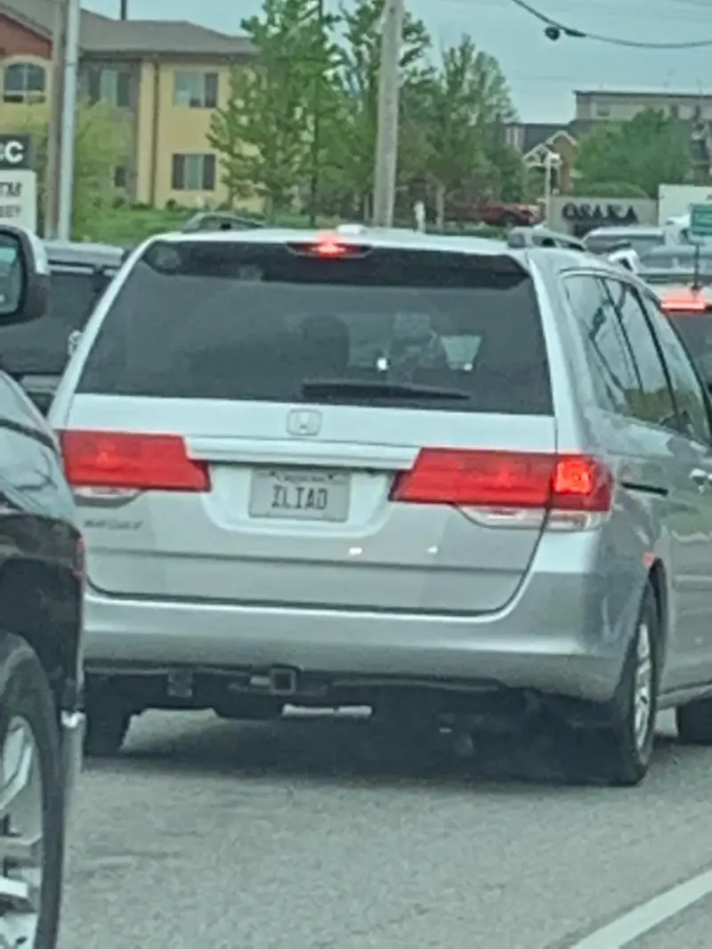 1. Whasaab, 2. Brand confusion, 3. Subauwu, 4. Get a load of this guy, 6. The impala, 7. An awh-sum car, 8. Ur obese, 9. Why be normal, 10. A very Canadian plate, 11. Comedy in one word, 12. Cheeto Jeep, 13. Luxury with a side of humility, 14. Midlife dream or crisis, 15. No problem parking, 16. Meta, 17. Sassy exit, 18. It’s a vibe, 19. License plate therapy session, 20. Purrsonality on wheels, 21. Owning it, 22. Keeping it literal, 23. Priorities on display, 24. Serving royal energy, 25. Weewoo on wheels, 26. Corvette over retirement, 27. Minivan mythology, 28. Big wheels, green dreams, 29. Owning the slow lane, 30. Queen of the mud pits