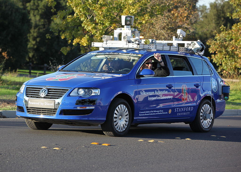 The Autonomous Leap: Toyota and Stanford's Sideways Innovation Debunking Myths About Used Cars, File:Polizia car drifting at Hollywood Stunt Driver.jpg, Elegant BMW car interior showcasing navigation screen, speedometer, and steering wheel., Rallye car drifting, The Autonomous Leap: Toyota and Stanford's Sideways Innovation