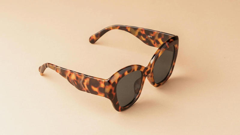 1. Classic Round Frames, 2. Bold Wayfarer Frames, 3. Transparent Frames, 4. Cat-Eye Glasses, 5. Oversized Frames, 6. Aviator Glasses, 7. Geometric Frames, 8. Wooden Frames, 9. Metal Rimless Glasses, 10. Double Bridge Frames, 11. Thick Black Frames, 12. Tortoiseshell Patterns, 13. Sporty Wrap-Around Frames, 14. Semi-Rimless Frames, 15. Gradient Color Frames, 16. Vintage Wire Frames, 17. Asymmetrical Frames, 18. Glow-In-The-Dark Frames, 19. Custom Painted Hand-Decorated Frames, 20. Eco-Friendly Recycled Material Frames