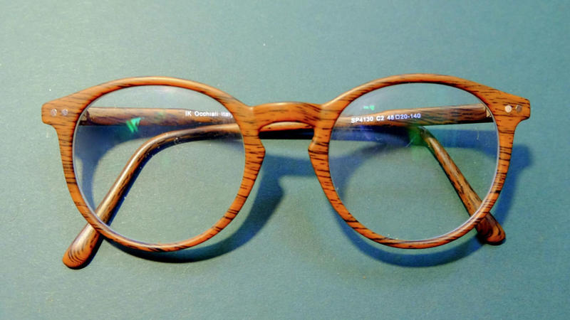 1. Classic Round Frames, 2. Bold Wayfarer Frames, 3. Transparent Frames, 4. Cat-Eye Glasses, 5. Oversized Frames, 6. Aviator Glasses, 7. Geometric Frames, 8. Wooden Frames, 9. Metal Rimless Glasses, 10. Double Bridge Frames, 11. Thick Black Frames, 12. Tortoiseshell Patterns, 13. Sporty Wrap-Around Frames, 14. Semi-Rimless Frames, 15. Gradient Color Frames, 16. Vintage Wire Frames, 17. Asymmetrical Frames, 18. Glow-In-The-Dark Frames, 19. Custom Painted Hand-Decorated Frames, 20. Eco-Friendly Recycled Material Frames