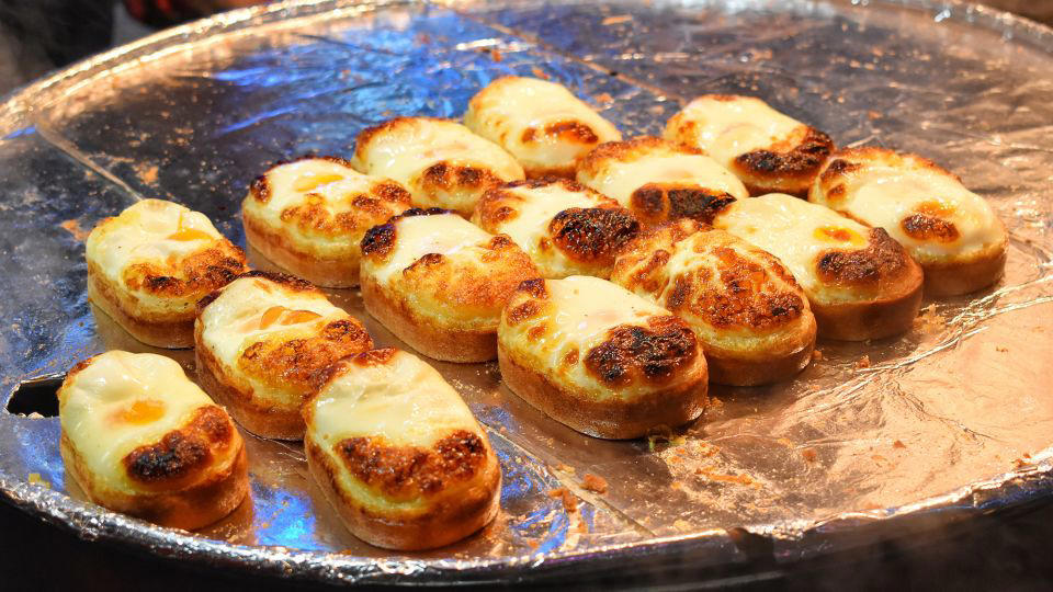 Bolani, Afghanistan, Lavash, Armenia, Damper bread, Australia, Luchi, Bangladesh, Pão de queijo, Brazil, Montreal bagels, Canada, Marraqueta, Chile, Shaobing, China, Pan Cubano, Cuba, Libba, Egypt, Pupusas, El Salvador, Injera, Ethiopia, Baguette, France, Khachapuri, Georgia, Pumpernickel, Germany, Pai bao, Hong Kong, Dökkt rúgbrauð, Iceland, Paratha, India, Roti gambang, Indonesia, Sangak, Iran, Soda bread, Ireland, Challah, Israel, Ciabatta, Italy, Bammy bread, Jamaica, Kare pan, Japan, Taboon bread, Jordan, Roti canai, Malaysia, Ħobż tal-Malti, Malta, Tortillas, Mexico, Khobz kesra, Morocco, Fry bread, Navajo Nation, Tijgerbrood, Netherlands, Rēwena parāoa, New Zealand, Lefse, Norway, Podplomyk, Poland, Broa de milho, Portugal, Karavai, Russia, Pane carasau, Sardinia, Proja, Serbia, Gyeran-ppang, South Korea, Appam, Sri Lanka, Kisra, Sudan and South Sudan, Limpa bread, Sweden, Balep korkun, Tibet, Simit, Turkey, Crumpets, United Kingdom, Biscuits, United States, Non, Uzbekistan, Arepa, Venezuela, Malawach, Yemen