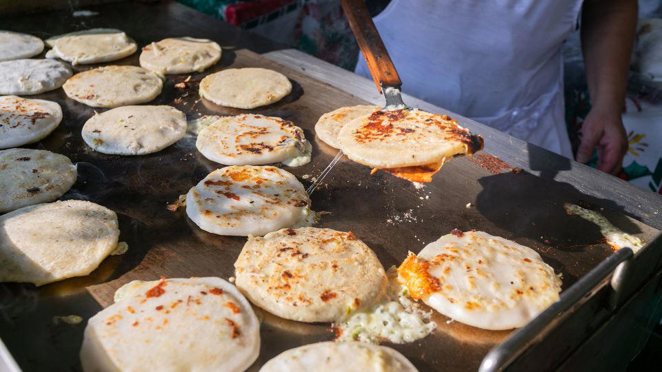 Bolani, Afghanistan, Lavash, Armenia, Damper bread, Australia, Luchi, Bangladesh, Pão de queijo, Brazil, Montreal bagels, Canada, Marraqueta, Chile, Shaobing, China, Pan Cubano, Cuba, Libba, Egypt, Pupusas, El Salvador, Injera, Ethiopia, Baguette, France, Khachapuri, Georgia, Pumpernickel, Germany, Pai bao, Hong Kong, Dökkt rúgbrauð, Iceland, Paratha, India, Roti gambang, Indonesia, Sangak, Iran, Soda bread, Ireland, Challah, Israel, Ciabatta, Italy, Bammy bread, Jamaica, Kare pan, Japan, Taboon bread, Jordan, Roti canai, Malaysia, Ħobż tal-Malti, Malta, Tortillas, Mexico, Khobz kesra, Morocco, Fry bread, Navajo Nation, Tijgerbrood, Netherlands, Rēwena parāoa, New Zealand, Lefse, Norway, Podplomyk, Poland, Broa de milho, Portugal, Karavai, Russia, Pane carasau, Sardinia, Proja, Serbia, Gyeran-ppang, South Korea, Appam, Sri Lanka, Kisra, Sudan and South Sudan, Limpa bread, Sweden, Balep korkun, Tibet, Simit, Turkey, Crumpets, United Kingdom, Biscuits, United States, Non, Uzbekistan, Arepa, Venezuela, Malawach, Yemen