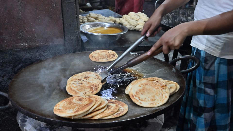 Bolani, Afghanistan, Lavash, Armenia, Damper bread, Australia, Luchi, Bangladesh, Pão de queijo, Brazil, Montreal bagels, Canada, Marraqueta, Chile, Shaobing, China, Pan Cubano, Cuba, Libba, Egypt, Pupusas, El Salvador, Injera, Ethiopia, Baguette, France, Khachapuri, Georgia, Pumpernickel, Germany, Pai bao, Hong Kong, Dökkt rúgbrauð, Iceland, Paratha, India, Roti gambang, Indonesia, Sangak, Iran, Soda bread, Ireland, Challah, Israel, Ciabatta, Italy, Bammy bread, Jamaica, Kare pan, Japan, Taboon bread, Jordan, Roti canai, Malaysia, Ħobż tal-Malti, Malta, Tortillas, Mexico, Khobz kesra, Morocco, Fry bread, Navajo Nation, Tijgerbrood, Netherlands, Rēwena parāoa, New Zealand, Lefse, Norway, Podplomyk, Poland, Broa de milho, Portugal, Karavai, Russia, Pane carasau, Sardinia, Proja, Serbia, Gyeran-ppang, South Korea, Appam, Sri Lanka, Kisra, Sudan and South Sudan, Limpa bread, Sweden, Balep korkun, Tibet, Simit, Turkey, Crumpets, United Kingdom, Biscuits, United States, Non, Uzbekistan, Arepa, Venezuela, Malawach, Yemen