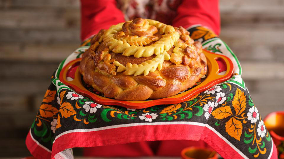 Bolani, Afghanistan, Lavash, Armenia, Damper bread, Australia, Luchi, Bangladesh, Pão de queijo, Brazil, Montreal bagels, Canada, Marraqueta, Chile, Shaobing, China, Pan Cubano, Cuba, Libba, Egypt, Pupusas, El Salvador, Injera, Ethiopia, Baguette, France, Khachapuri, Georgia, Pumpernickel, Germany, Pai bao, Hong Kong, Dökkt rúgbrauð, Iceland, Paratha, India, Roti gambang, Indonesia, Sangak, Iran, Soda bread, Ireland, Challah, Israel, Ciabatta, Italy, Bammy bread, Jamaica, Kare pan, Japan, Taboon bread, Jordan, Roti canai, Malaysia, Ħobż tal-Malti, Malta, Tortillas, Mexico, Khobz kesra, Morocco, Fry bread, Navajo Nation, Tijgerbrood, Netherlands, Rēwena parāoa, New Zealand, Lefse, Norway, Podplomyk, Poland, Broa de milho, Portugal, Karavai, Russia, Pane carasau, Sardinia, Proja, Serbia, Gyeran-ppang, South Korea, Appam, Sri Lanka, Kisra, Sudan and South Sudan, Limpa bread, Sweden, Balep korkun, Tibet, Simit, Turkey, Crumpets, United Kingdom, Biscuits, United States, Non, Uzbekistan, Arepa, Venezuela, Malawach, Yemen