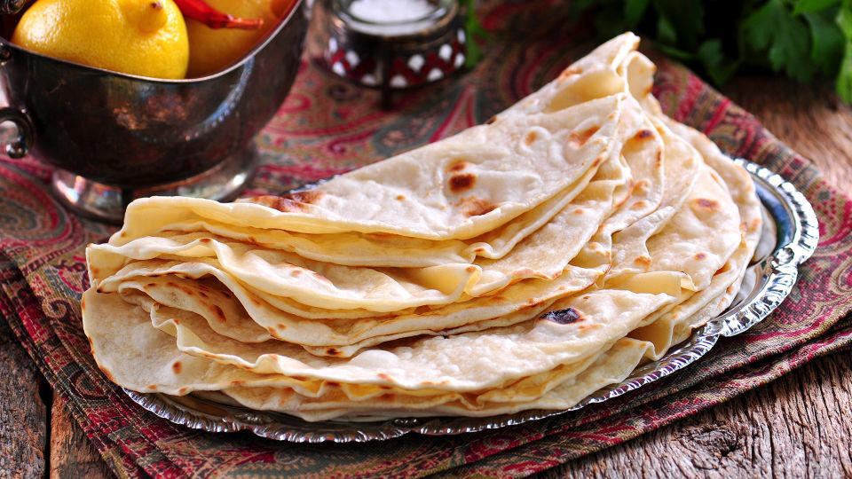 Bolani, Afghanistan, Lavash, Armenia, Damper bread, Australia, Luchi, Bangladesh, Pão de queijo, Brazil, Montreal bagels, Canada, Marraqueta, Chile, Shaobing, China, Pan Cubano, Cuba, Libba, Egypt, Pupusas, El Salvador, Injera, Ethiopia, Baguette, France, Khachapuri, Georgia, Pumpernickel, Germany, Pai bao, Hong Kong, Dökkt rúgbrauð, Iceland, Paratha, India, Roti gambang, Indonesia, Sangak, Iran, Soda bread, Ireland, Challah, Israel, Ciabatta, Italy, Bammy bread, Jamaica, Kare pan, Japan, Taboon bread, Jordan, Roti canai, Malaysia, Ħobż tal-Malti, Malta, Tortillas, Mexico, Khobz kesra, Morocco, Fry bread, Navajo Nation, Tijgerbrood, Netherlands, Rēwena parāoa, New Zealand, Lefse, Norway, Podplomyk, Poland, Broa de milho, Portugal, Karavai, Russia, Pane carasau, Sardinia, Proja, Serbia, Gyeran-ppang, South Korea, Appam, Sri Lanka, Kisra, Sudan and South Sudan, Limpa bread, Sweden, Balep korkun, Tibet, Simit, Turkey, Crumpets, United Kingdom, Biscuits, United States, Non, Uzbekistan, Arepa, Venezuela, Malawach, Yemen