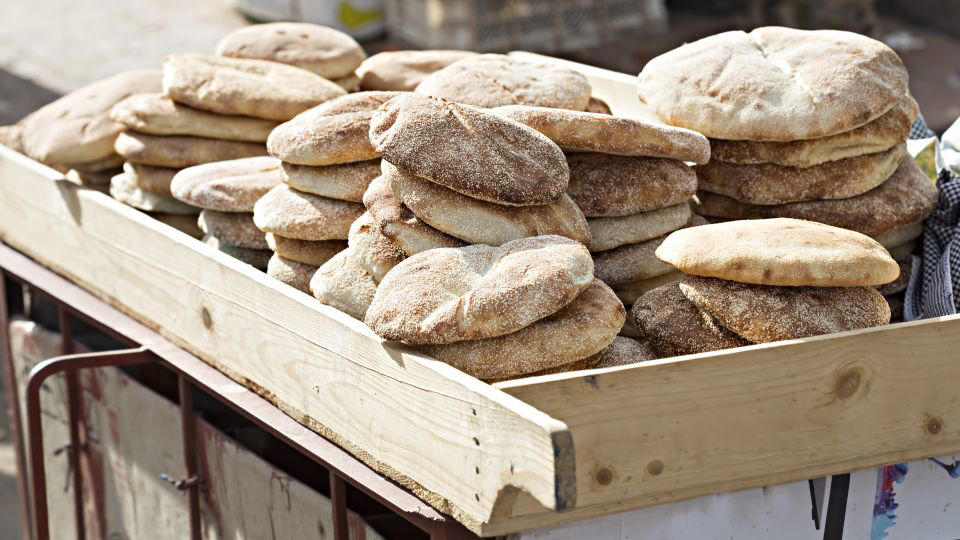 Bolani, Afghanistan, Lavash, Armenia, Damper bread, Australia, Luchi, Bangladesh, Pão de queijo, Brazil, Montreal bagels, Canada, Marraqueta, Chile, Shaobing, China, Pan Cubano, Cuba, Libba, Egypt, Pupusas, El Salvador, Injera, Ethiopia, Baguette, France, Khachapuri, Georgia, Pumpernickel, Germany, Pai bao, Hong Kong, Dökkt rúgbrauð, Iceland, Paratha, India, Roti gambang, Indonesia, Sangak, Iran, Soda bread, Ireland, Challah, Israel, Ciabatta, Italy, Bammy bread, Jamaica, Kare pan, Japan, Taboon bread, Jordan, Roti canai, Malaysia, Ħobż tal-Malti, Malta, Tortillas, Mexico, Khobz kesra, Morocco, Fry bread, Navajo Nation, Tijgerbrood, Netherlands, Rēwena parāoa, New Zealand, Lefse, Norway, Podplomyk, Poland, Broa de milho, Portugal, Karavai, Russia, Pane carasau, Sardinia, Proja, Serbia, Gyeran-ppang, South Korea, Appam, Sri Lanka, Kisra, Sudan and South Sudan, Limpa bread, Sweden, Balep korkun, Tibet, Simit, Turkey, Crumpets, United Kingdom, Biscuits, United States, Non, Uzbekistan, Arepa, Venezuela, Malawach, Yemen