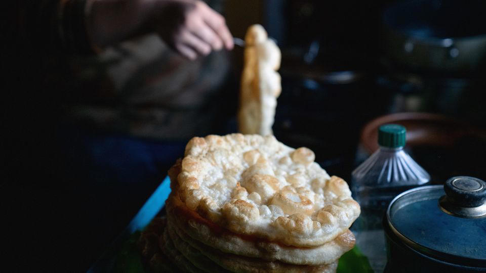 Bolani, Afghanistan, Lavash, Armenia, Damper bread, Australia, Luchi, Bangladesh, Pão de queijo, Brazil, Montreal bagels, Canada, Marraqueta, Chile, Shaobing, China, Pan Cubano, Cuba, Libba, Egypt, Pupusas, El Salvador, Injera, Ethiopia, Baguette, France, Khachapuri, Georgia, Pumpernickel, Germany, Pai bao, Hong Kong, Dökkt rúgbrauð, Iceland, Paratha, India, Roti gambang, Indonesia, Sangak, Iran, Soda bread, Ireland, Challah, Israel, Ciabatta, Italy, Bammy bread, Jamaica, Kare pan, Japan, Taboon bread, Jordan, Roti canai, Malaysia, Ħobż tal-Malti, Malta, Tortillas, Mexico, Khobz kesra, Morocco, Fry bread, Navajo Nation, Tijgerbrood, Netherlands, Rēwena parāoa, New Zealand, Lefse, Norway, Podplomyk, Poland, Broa de milho, Portugal, Karavai, Russia, Pane carasau, Sardinia, Proja, Serbia, Gyeran-ppang, South Korea, Appam, Sri Lanka, Kisra, Sudan and South Sudan, Limpa bread, Sweden, Balep korkun, Tibet, Simit, Turkey, Crumpets, United Kingdom, Biscuits, United States, Non, Uzbekistan, Arepa, Venezuela, Malawach, Yemen