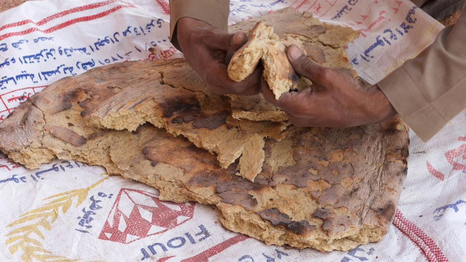 Bolani, Afghanistan, Lavash, Armenia, Damper bread, Australia, Luchi, Bangladesh, Pão de queijo, Brazil, Montreal bagels, Canada, Marraqueta, Chile, Shaobing, China, Pan Cubano, Cuba, Libba, Egypt, Pupusas, El Salvador, Injera, Ethiopia, Baguette, France, Khachapuri, Georgia, Pumpernickel, Germany, Pai bao, Hong Kong, Dökkt rúgbrauð, Iceland, Paratha, India, Roti gambang, Indonesia, Sangak, Iran, Soda bread, Ireland, Challah, Israel, Ciabatta, Italy, Bammy bread, Jamaica, Kare pan, Japan, Taboon bread, Jordan, Roti canai, Malaysia, Ħobż tal-Malti, Malta, Tortillas, Mexico, Khobz kesra, Morocco, Fry bread, Navajo Nation, Tijgerbrood, Netherlands, Rēwena parāoa, New Zealand, Lefse, Norway, Podplomyk, Poland, Broa de milho, Portugal, Karavai, Russia, Pane carasau, Sardinia, Proja, Serbia, Gyeran-ppang, South Korea, Appam, Sri Lanka, Kisra, Sudan and South Sudan, Limpa bread, Sweden, Balep korkun, Tibet, Simit, Turkey, Crumpets, United Kingdom, Biscuits, United States, Non, Uzbekistan, Arepa, Venezuela, Malawach, Yemen