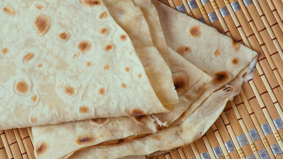 Bolani, Afghanistan, Lavash, Armenia, Damper bread, Australia, Luchi, Bangladesh, Pão de queijo, Brazil, Montreal bagels, Canada, Marraqueta, Chile, Shaobing, China, Pan Cubano, Cuba, Libba, Egypt, Pupusas, El Salvador, Injera, Ethiopia, Baguette, France, Khachapuri, Georgia, Pumpernickel, Germany, Pai bao, Hong Kong, Dökkt rúgbrauð, Iceland, Paratha, India, Roti gambang, Indonesia, Sangak, Iran, Soda bread, Ireland, Challah, Israel, Ciabatta, Italy, Bammy bread, Jamaica, Kare pan, Japan, Taboon bread, Jordan, Roti canai, Malaysia, Ħobż tal-Malti, Malta, Tortillas, Mexico, Khobz kesra, Morocco, Fry bread, Navajo Nation, Tijgerbrood, Netherlands, Rēwena parāoa, New Zealand, Lefse, Norway, Podplomyk, Poland, Broa de milho, Portugal, Karavai, Russia, Pane carasau, Sardinia, Proja, Serbia, Gyeran-ppang, South Korea, Appam, Sri Lanka, Kisra, Sudan and South Sudan, Limpa bread, Sweden, Balep korkun, Tibet, Simit, Turkey, Crumpets, United Kingdom, Biscuits, United States, Non, Uzbekistan, Arepa, Venezuela, Malawach, Yemen