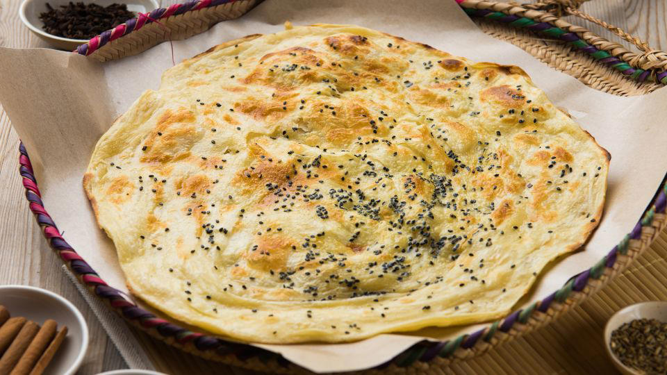 Bolani, Afghanistan, Lavash, Armenia, Damper bread, Australia, Luchi, Bangladesh, Pão de queijo, Brazil, Montreal bagels, Canada, Marraqueta, Chile, Shaobing, China, Pan Cubano, Cuba, Libba, Egypt, Pupusas, El Salvador, Injera, Ethiopia, Baguette, France, Khachapuri, Georgia, Pumpernickel, Germany, Pai bao, Hong Kong, Dökkt rúgbrauð, Iceland, Paratha, India, Roti gambang, Indonesia, Sangak, Iran, Soda bread, Ireland, Challah, Israel, Ciabatta, Italy, Bammy bread, Jamaica, Kare pan, Japan, Taboon bread, Jordan, Roti canai, Malaysia, Ħobż tal-Malti, Malta, Tortillas, Mexico, Khobz kesra, Morocco, Fry bread, Navajo Nation, Tijgerbrood, Netherlands, Rēwena parāoa, New Zealand, Lefse, Norway, Podplomyk, Poland, Broa de milho, Portugal, Karavai, Russia, Pane carasau, Sardinia, Proja, Serbia, Gyeran-ppang, South Korea, Appam, Sri Lanka, Kisra, Sudan and South Sudan, Limpa bread, Sweden, Balep korkun, Tibet, Simit, Turkey, Crumpets, United Kingdom, Biscuits, United States, Non, Uzbekistan, Arepa, Venezuela, Malawach, Yemen