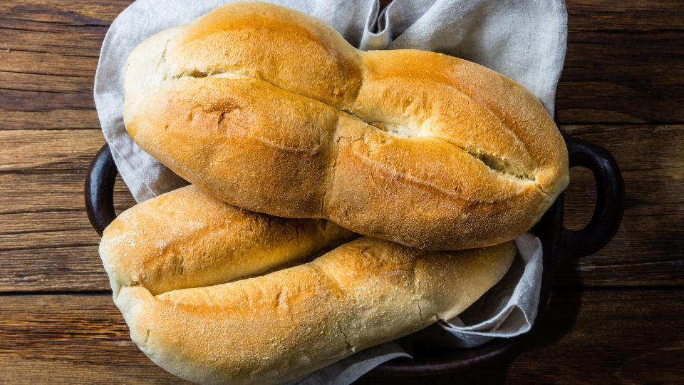 Bolani, Afghanistan, Lavash, Armenia, Damper bread, Australia, Luchi, Bangladesh, Pão de queijo, Brazil, Montreal bagels, Canada, Marraqueta, Chile, Shaobing, China, Pan Cubano, Cuba, Libba, Egypt, Pupusas, El Salvador, Injera, Ethiopia, Baguette, France, Khachapuri, Georgia, Pumpernickel, Germany, Pai bao, Hong Kong, Dökkt rúgbrauð, Iceland, Paratha, India, Roti gambang, Indonesia, Sangak, Iran, Soda bread, Ireland, Challah, Israel, Ciabatta, Italy, Bammy bread, Jamaica, Kare pan, Japan, Taboon bread, Jordan, Roti canai, Malaysia, Ħobż tal-Malti, Malta, Tortillas, Mexico, Khobz kesra, Morocco, Fry bread, Navajo Nation, Tijgerbrood, Netherlands, Rēwena parāoa, New Zealand, Lefse, Norway, Podplomyk, Poland, Broa de milho, Portugal, Karavai, Russia, Pane carasau, Sardinia, Proja, Serbia, Gyeran-ppang, South Korea, Appam, Sri Lanka, Kisra, Sudan and South Sudan, Limpa bread, Sweden, Balep korkun, Tibet, Simit, Turkey, Crumpets, United Kingdom, Biscuits, United States, Non, Uzbekistan, Arepa, Venezuela, Malawach, Yemen
