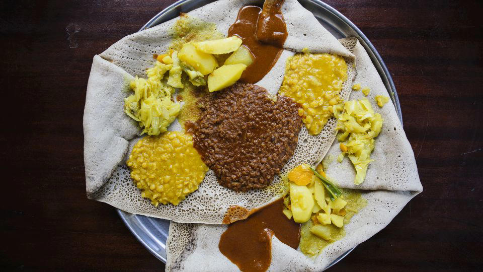 Bolani, Afghanistan, Lavash, Armenia, Damper bread, Australia, Luchi, Bangladesh, Pão de queijo, Brazil, Montreal bagels, Canada, Marraqueta, Chile, Shaobing, China, Pan Cubano, Cuba, Libba, Egypt, Pupusas, El Salvador, Injera, Ethiopia, Baguette, France, Khachapuri, Georgia, Pumpernickel, Germany, Pai bao, Hong Kong, Dökkt rúgbrauð, Iceland, Paratha, India, Roti gambang, Indonesia, Sangak, Iran, Soda bread, Ireland, Challah, Israel, Ciabatta, Italy, Bammy bread, Jamaica, Kare pan, Japan, Taboon bread, Jordan, Roti canai, Malaysia, Ħobż tal-Malti, Malta, Tortillas, Mexico, Khobz kesra, Morocco, Fry bread, Navajo Nation, Tijgerbrood, Netherlands, Rēwena parāoa, New Zealand, Lefse, Norway, Podplomyk, Poland, Broa de milho, Portugal, Karavai, Russia, Pane carasau, Sardinia, Proja, Serbia, Gyeran-ppang, South Korea, Appam, Sri Lanka, Kisra, Sudan and South Sudan, Limpa bread, Sweden, Balep korkun, Tibet, Simit, Turkey, Crumpets, United Kingdom, Biscuits, United States, Non, Uzbekistan, Arepa, Venezuela, Malawach, Yemen