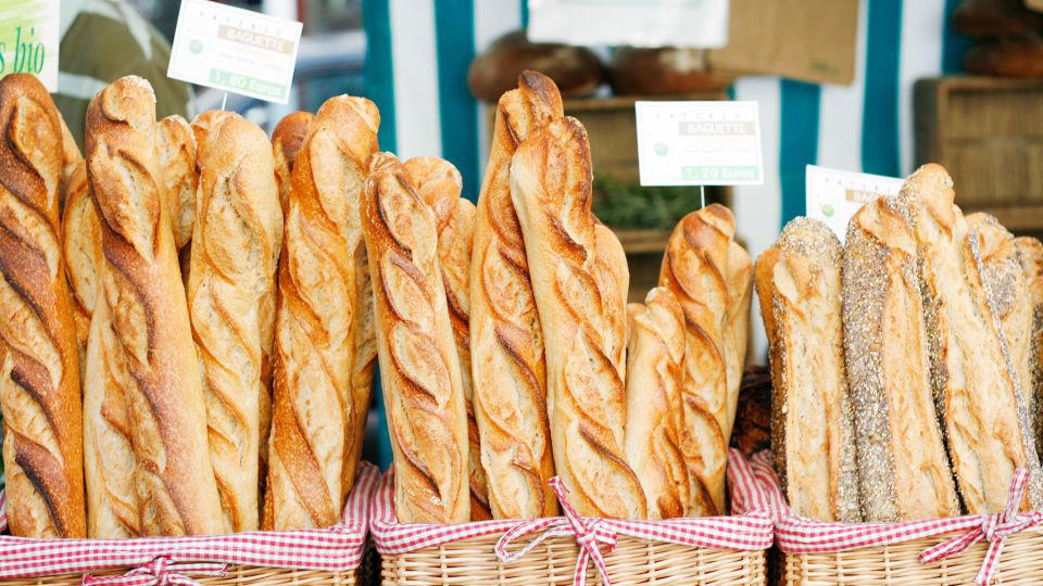 Bolani, Afghanistan, Lavash, Armenia, Damper bread, Australia, Luchi, Bangladesh, Pão de queijo, Brazil, Montreal bagels, Canada, Marraqueta, Chile, Shaobing, China, Pan Cubano, Cuba, Libba, Egypt, Pupusas, El Salvador, Injera, Ethiopia, Baguette, France, Khachapuri, Georgia, Pumpernickel, Germany, Pai bao, Hong Kong, Dökkt rúgbrauð, Iceland, Paratha, India, Roti gambang, Indonesia, Sangak, Iran, Soda bread, Ireland, Challah, Israel, Ciabatta, Italy, Bammy bread, Jamaica, Kare pan, Japan, Taboon bread, Jordan, Roti canai, Malaysia, Ħobż tal-Malti, Malta, Tortillas, Mexico, Khobz kesra, Morocco, Fry bread, Navajo Nation, Tijgerbrood, Netherlands, Rēwena parāoa, New Zealand, Lefse, Norway, Podplomyk, Poland, Broa de milho, Portugal, Karavai, Russia, Pane carasau, Sardinia, Proja, Serbia, Gyeran-ppang, South Korea, Appam, Sri Lanka, Kisra, Sudan and South Sudan, Limpa bread, Sweden, Balep korkun, Tibet, Simit, Turkey, Crumpets, United Kingdom, Biscuits, United States, Non, Uzbekistan, Arepa, Venezuela, Malawach, Yemen