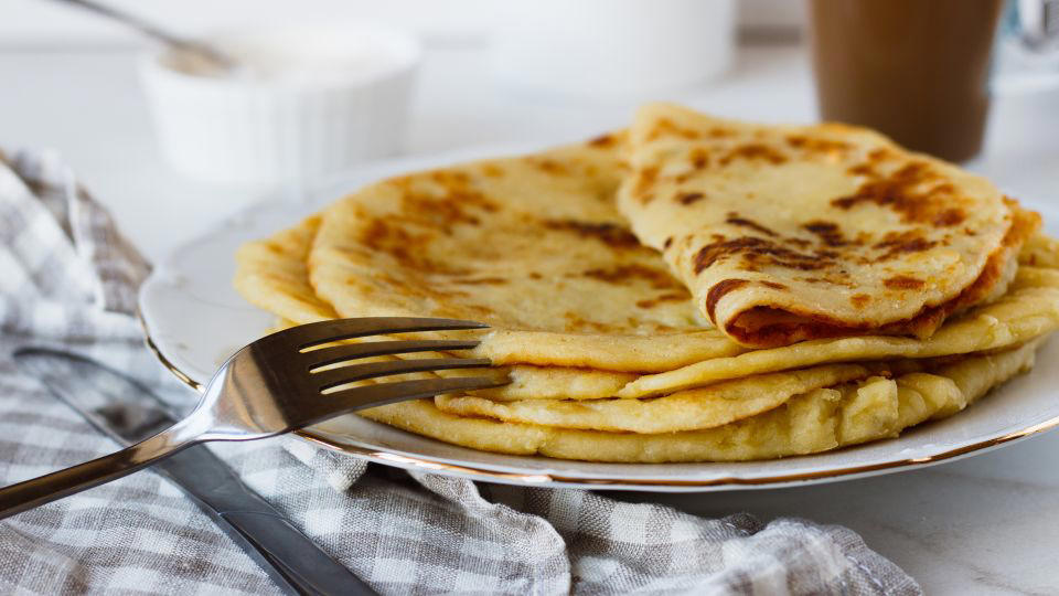 Bolani, Afghanistan, Lavash, Armenia, Damper bread, Australia, Luchi, Bangladesh, Pão de queijo, Brazil, Montreal bagels, Canada, Marraqueta, Chile, Shaobing, China, Pan Cubano, Cuba, Libba, Egypt, Pupusas, El Salvador, Injera, Ethiopia, Baguette, France, Khachapuri, Georgia, Pumpernickel, Germany, Pai bao, Hong Kong, Dökkt rúgbrauð, Iceland, Paratha, India, Roti gambang, Indonesia, Sangak, Iran, Soda bread, Ireland, Challah, Israel, Ciabatta, Italy, Bammy bread, Jamaica, Kare pan, Japan, Taboon bread, Jordan, Roti canai, Malaysia, Ħobż tal-Malti, Malta, Tortillas, Mexico, Khobz kesra, Morocco, Fry bread, Navajo Nation, Tijgerbrood, Netherlands, Rēwena parāoa, New Zealand, Lefse, Norway, Podplomyk, Poland, Broa de milho, Portugal, Karavai, Russia, Pane carasau, Sardinia, Proja, Serbia, Gyeran-ppang, South Korea, Appam, Sri Lanka, Kisra, Sudan and South Sudan, Limpa bread, Sweden, Balep korkun, Tibet, Simit, Turkey, Crumpets, United Kingdom, Biscuits, United States, Non, Uzbekistan, Arepa, Venezuela, Malawach, Yemen