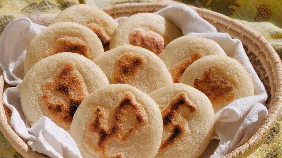 Bolani, Afghanistan, Lavash, Armenia, Damper bread, Australia, Luchi, Bangladesh, Pão de queijo, Brazil, Montreal bagels, Canada, Marraqueta, Chile, Shaobing, China, Pan Cubano, Cuba, Libba, Egypt, Pupusas, El Salvador, Injera, Ethiopia, Baguette, France, Khachapuri, Georgia, Pumpernickel, Germany, Pai bao, Hong Kong, Dökkt rúgbrauð, Iceland, Paratha, India, Roti gambang, Indonesia, Sangak, Iran, Soda bread, Ireland, Challah, Israel, Ciabatta, Italy, Bammy bread, Jamaica, Kare pan, Japan, Taboon bread, Jordan, Roti canai, Malaysia, Ħobż tal-Malti, Malta, Tortillas, Mexico, Khobz kesra, Morocco, Fry bread, Navajo Nation, Tijgerbrood, Netherlands, Rēwena parāoa, New Zealand, Lefse, Norway, Podplomyk, Poland, Broa de milho, Portugal, Karavai, Russia, Pane carasau, Sardinia, Proja, Serbia, Gyeran-ppang, South Korea, Appam, Sri Lanka, Kisra, Sudan and South Sudan, Limpa bread, Sweden, Balep korkun, Tibet, Simit, Turkey, Crumpets, United Kingdom, Biscuits, United States, Non, Uzbekistan, Arepa, Venezuela, Malawach, Yemen