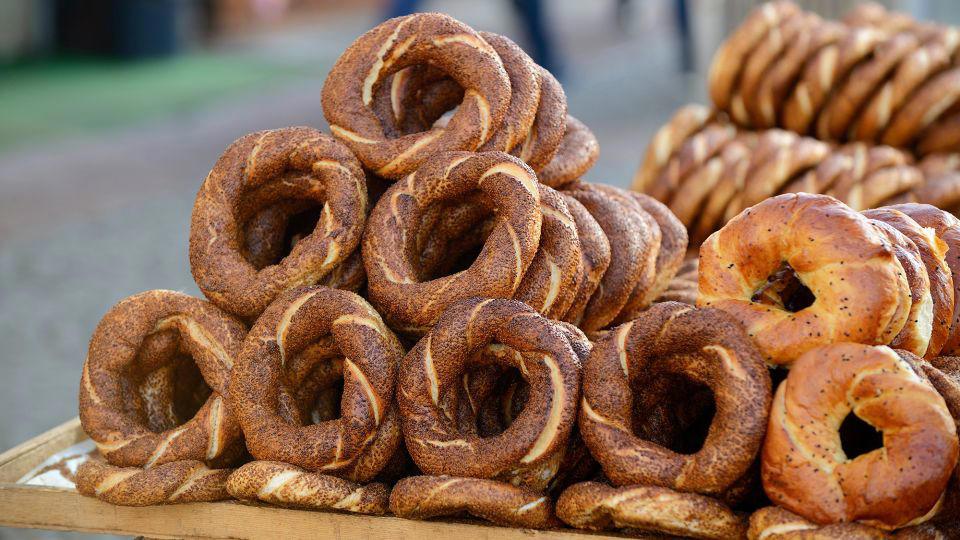 Bolani, Afghanistan, Lavash, Armenia, Damper bread, Australia, Luchi, Bangladesh, Pão de queijo, Brazil, Montreal bagels, Canada, Marraqueta, Chile, Shaobing, China, Pan Cubano, Cuba, Libba, Egypt, Pupusas, El Salvador, Injera, Ethiopia, Baguette, France, Khachapuri, Georgia, Pumpernickel, Germany, Pai bao, Hong Kong, Dökkt rúgbrauð, Iceland, Paratha, India, Roti gambang, Indonesia, Sangak, Iran, Soda bread, Ireland, Challah, Israel, Ciabatta, Italy, Bammy bread, Jamaica, Kare pan, Japan, Taboon bread, Jordan, Roti canai, Malaysia, Ħobż tal-Malti, Malta, Tortillas, Mexico, Khobz kesra, Morocco, Fry bread, Navajo Nation, Tijgerbrood, Netherlands, Rēwena parāoa, New Zealand, Lefse, Norway, Podplomyk, Poland, Broa de milho, Portugal, Karavai, Russia, Pane carasau, Sardinia, Proja, Serbia, Gyeran-ppang, South Korea, Appam, Sri Lanka, Kisra, Sudan and South Sudan, Limpa bread, Sweden, Balep korkun, Tibet, Simit, Turkey, Crumpets, United Kingdom, Biscuits, United States, Non, Uzbekistan, Arepa, Venezuela, Malawach, Yemen