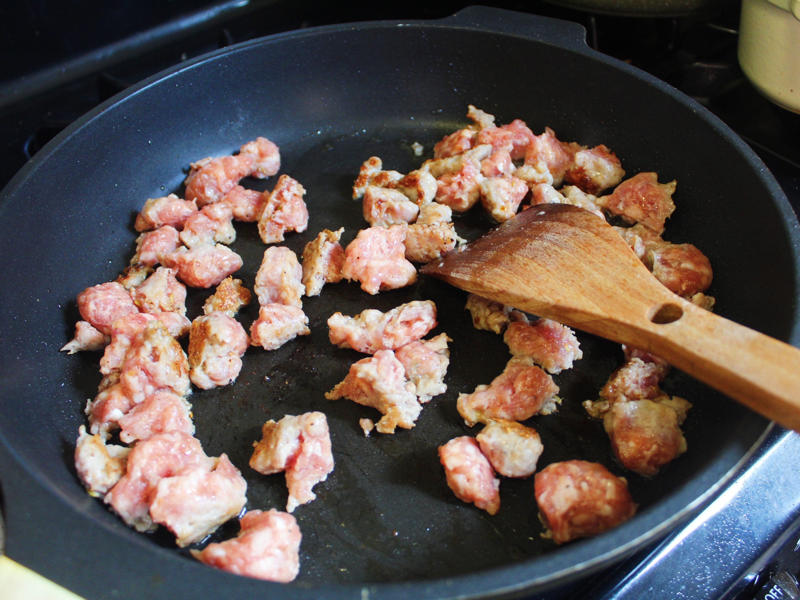 After prepping my vegetables, I heated the olive oil in a pan and added the sweet sausage meat.