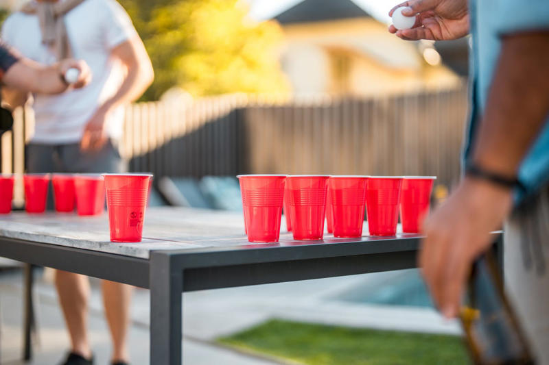 5) Flip Cup 1) Fish Bowl, 2) Euchre, 3) Lip Sync Battle, 4) Freeze Dance, 5) Flip Cup, 6) Limbo, 7) 20 Questions, 8) Musical Chairs, 9) Never Have I Ever, 10) Spoons, 11) Heads Up 7 Up, 12) Name That Tune, 14) Minute to Win It Games, 15) Post It Note Game, 16) Bobbing for Apples, 17) Pin the Tail on the Donkey, 18) Charades, 19) Hot Ones, 20) Egg and Spoon Race, 21) Two Truths and a Lie, 22) Oreo Game, 23) Superlatives, 24) Telephone, 25) Twister, 26) Would You Rather, 27) Dangling Donuts, 28) iSpy