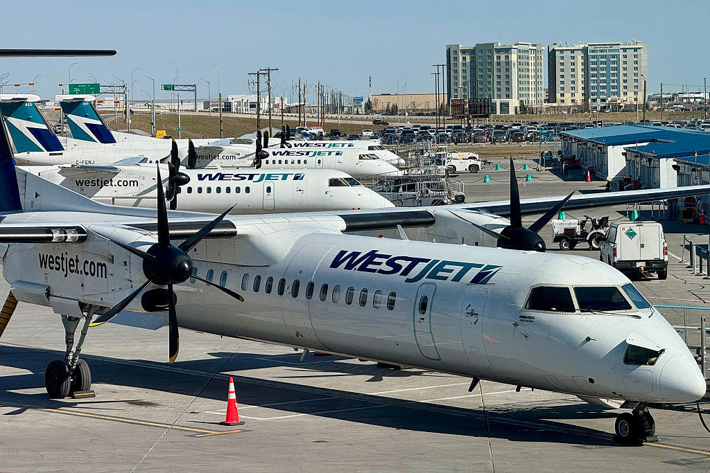 WestJet planes parked at Calgary International Airport apron Governor General of Canada Mary Simon arrives for cabinet swearing-in ceremony, King Charles III participates in ceremonial tree planting at Rideau Hall, WestJet planes parked at Calgary International Airport apron, Governor General of Canada Mary Simon speaks during meeting with Pope Francis, Mark Carney sits beside Governor General Mary Simon at swearing-in, Pope Francis and Governor General Mary Simon attend meeting in Quebec, Air Canada plane taxis at Calgary International Airport