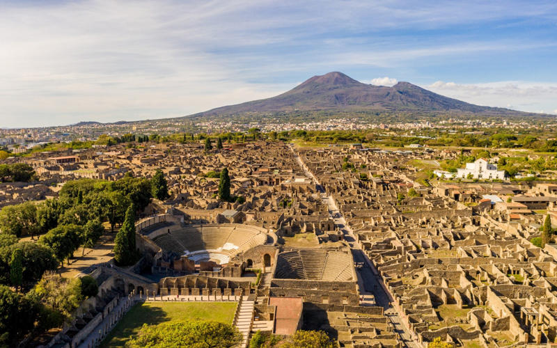 50. Tower of Hercules, Spain, 49. Felix Romuliana, Serbia, 48. Capidava, Romania, 47. Garni Temple, Armenia, 46. The Walls of Lugo, Spain, 45. Temple of Évora, Portugal, 44. The Basilica Cistern, Turkey, 43. Theatre of Philippopolis, Bulgaria, 42. Butrint, Albania, 41. Paphos Archaeological Park, Cyprus, 40. The Antonine Wall, UK, 39. The Temple of Jupiter, Damascus, Syria, 38. The Theatre of Vienne, France, 37. Kom el-Dikka, Egypt, 36. Palmyra, Syria, 35. Ostia Antica, Italy, 34. Arena of Nîmes, France, 33. Arles Amphitheatre, France, 32. Roman Carthage, Tunisia, 31. Antium, Italy, 30. Sabratha, Libya, 29. Djémila, Algeria, 28. Verona Arena, Italy, 27. Amphitheatre of El Jem, Tunisia, 26. Aqueduct of Segovia, Spain, 25. Pula Amphitheatre, Croatia, 24. Villa Adriana, Italy, 23. Tarraco, Spain, 22. Herculaneum, Italy, 21. Jerash, Jordan, 20. Aula Palatina, Germany, 19. Volubilis, Morocco, 18. Theatre of Aspendos, Turkey, 17. Theatre of Bosra, Syria, 16. Temple of Bacchus at Baalbek, Lebanon, 15. Hadrian’s Library and The Odeon of Herodes Atticus, Greece, 14. Caesarea Maritima, Israel, 13. Leptis Magna, Libya, 12. Timgad, Algeria, 11. The Roman Baths, UK, 10. Pont du Gard, France, 9. The Baths of Caracalla/The Circus Maximus, Italy, 8. Augusta Emerita, Spain, 7. The Library of Celsus, Turkey, 6. Theatre of Orange, France, 5. The Pantheon, Italy, 4. The Palace of Diocletian, Croatia, 3. Hadrian’s Wall, UK, 2. The Roman Forum/The Colosseum, Italy, 1. Pompeii, Italy