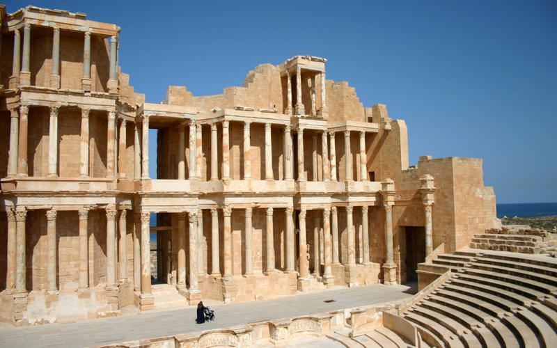 50. Tower of Hercules, Spain, 49. Felix Romuliana, Serbia, 48. Capidava, Romania, 47. Garni Temple, Armenia, 46. The Walls of Lugo, Spain, 45. Temple of Évora, Portugal, 44. The Basilica Cistern, Turkey, 43. Theatre of Philippopolis, Bulgaria, 42. Butrint, Albania, 41. Paphos Archaeological Park, Cyprus, 40. The Antonine Wall, UK, 39. The Temple of Jupiter, Damascus, Syria, 38. The Theatre of Vienne, France, 37. Kom el-Dikka, Egypt, 36. Palmyra, Syria, 35. Ostia Antica, Italy, 34. Arena of Nîmes, France, 33. Arles Amphitheatre, France, 32. Roman Carthage, Tunisia, 31. Antium, Italy, 30. Sabratha, Libya, 29. Djémila, Algeria, 28. Verona Arena, Italy, 27. Amphitheatre of El Jem, Tunisia, 26. Aqueduct of Segovia, Spain, 25. Pula Amphitheatre, Croatia, 24. Villa Adriana, Italy, 23. Tarraco, Spain, 22. Herculaneum, Italy, 21. Jerash, Jordan, 20. Aula Palatina, Germany, 19. Volubilis, Morocco, 18. Theatre of Aspendos, Turkey, 17. Theatre of Bosra, Syria, 16. Temple of Bacchus at Baalbek, Lebanon, 15. Hadrian’s Library and The Odeon of Herodes Atticus, Greece, 14. Caesarea Maritima, Israel, 13. Leptis Magna, Libya, 12. Timgad, Algeria, 11. The Roman Baths, UK, 10. Pont du Gard, France, 9. The Baths of Caracalla/The Circus Maximus, Italy, 8. Augusta Emerita, Spain, 7. The Library of Celsus, Turkey, 6. Theatre of Orange, France, 5. The Pantheon, Italy, 4. The Palace of Diocletian, Croatia, 3. Hadrian’s Wall, UK, 2. The Roman Forum/The Colosseum, Italy, 1. Pompeii, Italy