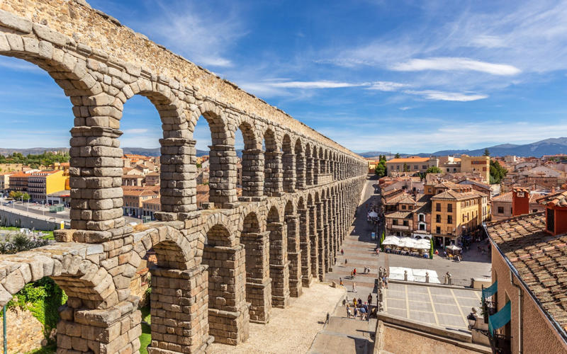 50. Tower of Hercules, Spain, 49. Felix Romuliana, Serbia, 48. Capidava, Romania, 47. Garni Temple, Armenia, 46. The Walls of Lugo, Spain, 45. Temple of Évora, Portugal, 44. The Basilica Cistern, Turkey, 43. Theatre of Philippopolis, Bulgaria, 42. Butrint, Albania, 41. Paphos Archaeological Park, Cyprus, 40. The Antonine Wall, UK, 39. The Temple of Jupiter, Damascus, Syria, 38. The Theatre of Vienne, France, 37. Kom el-Dikka, Egypt, 36. Palmyra, Syria, 35. Ostia Antica, Italy, 34. Arena of Nîmes, France, 33. Arles Amphitheatre, France, 32. Roman Carthage, Tunisia, 31. Antium, Italy, 30. Sabratha, Libya, 29. Djémila, Algeria, 28. Verona Arena, Italy, 27. Amphitheatre of El Jem, Tunisia, 26. Aqueduct of Segovia, Spain, 25. Pula Amphitheatre, Croatia, 24. Villa Adriana, Italy, 23. Tarraco, Spain, 22. Herculaneum, Italy, 21. Jerash, Jordan, 20. Aula Palatina, Germany, 19. Volubilis, Morocco, 18. Theatre of Aspendos, Turkey, 17. Theatre of Bosra, Syria, 16. Temple of Bacchus at Baalbek, Lebanon, 15. Hadrian’s Library and The Odeon of Herodes Atticus, Greece, 14. Caesarea Maritima, Israel, 13. Leptis Magna, Libya, 12. Timgad, Algeria, 11. The Roman Baths, UK, 10. Pont du Gard, France, 9. The Baths of Caracalla/The Circus Maximus, Italy, 8. Augusta Emerita, Spain, 7. The Library of Celsus, Turkey, 6. Theatre of Orange, France, 5. The Pantheon, Italy, 4. The Palace of Diocletian, Croatia, 3. Hadrian’s Wall, UK, 2. The Roman Forum/The Colosseum, Italy, 1. Pompeii, Italy